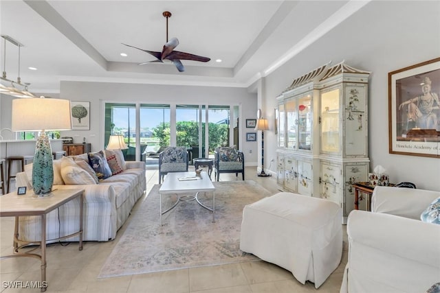 28589 Wharton Dr, Bonita Springs, FL 34135 - living area with light tile patterned flooring, ceiling fan, a tray ceiling, and recessed lighting