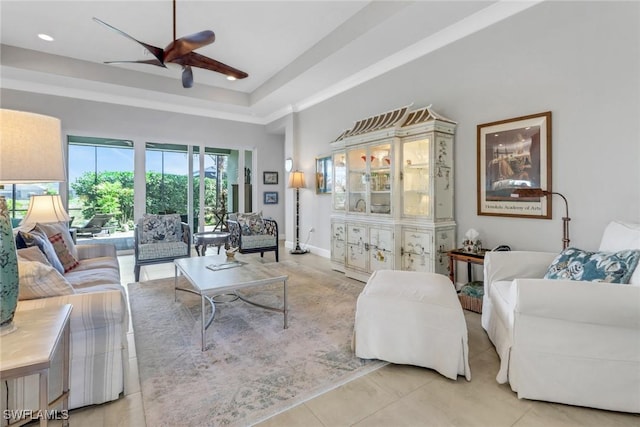 28589 Wharton Dr, Bonita Springs, FL 34135 - living room with a tray ceiling, light tile patterned flooring, a ceiling fan, and recessed lighting