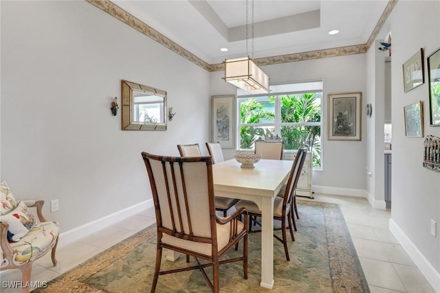 28589 Wharton Dr, Bonita Springs, FL 34135 - dining space featuring light tile patterned floors, baseboards, and a tray ceiling