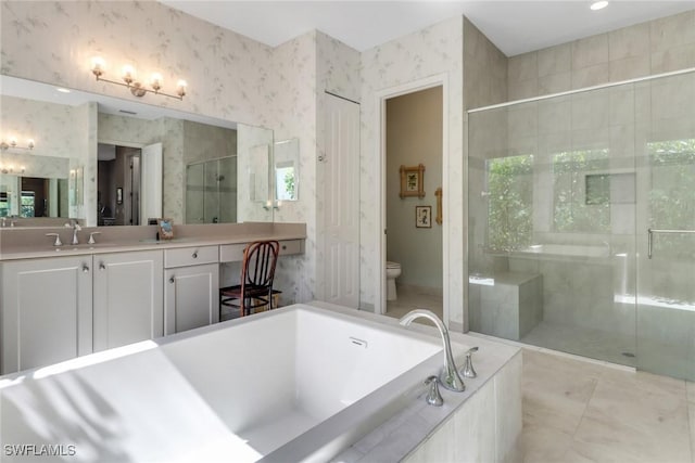 28589 Wharton Dr, Bonita Springs, FL 34135 - bathroom featuring a stall shower, a garden tub, toilet, and wallpapered walls