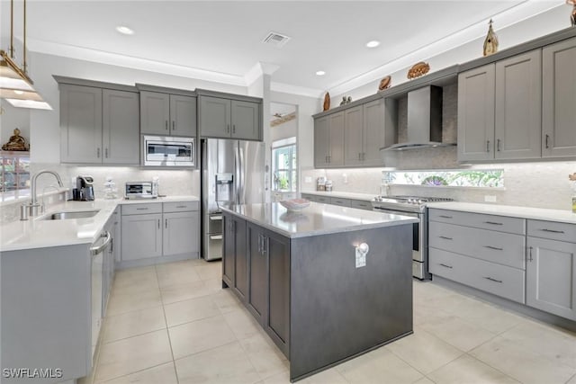28589 Wharton Dr, Bonita Springs, FL 34135 - kitchen with a sink, ornamental molding, wall chimney range hood, appliances with stainless steel finishes, and gray cabinets