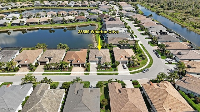 28589 Wharton Dr, Bonita Springs, FL 34135 - drone / aerial view with a residential view and a water view