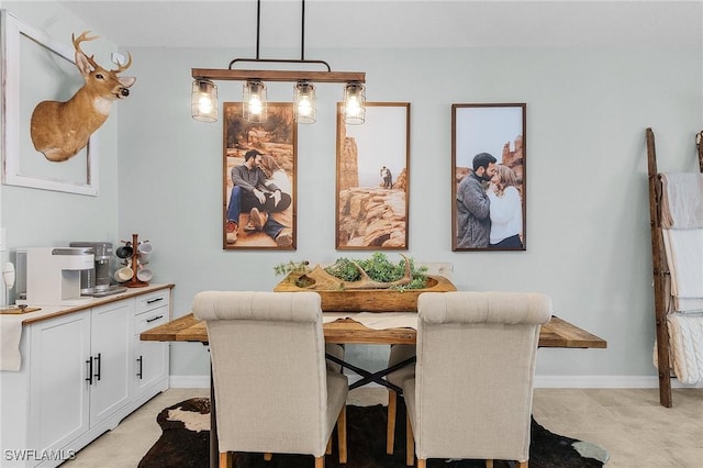 dining space with baseboards