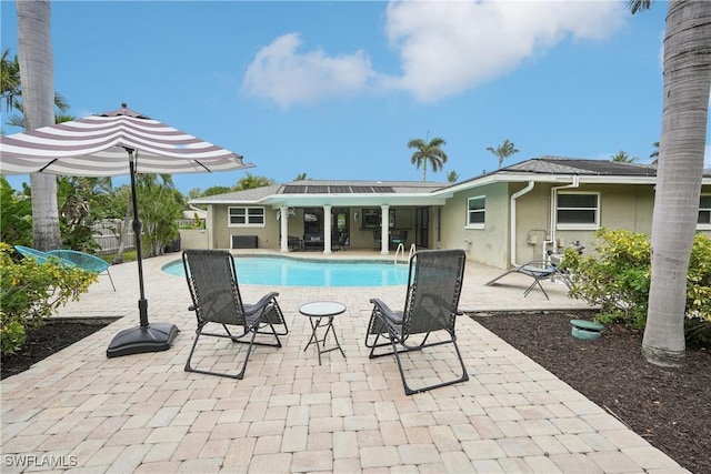 outdoor pool featuring a patio area