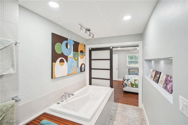 bathroom featuring ensuite bathroom, recessed lighting, visible vents, baseboards, and a jetted tub