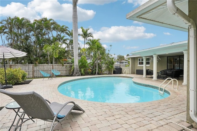 view of pool with a fenced in pool, a fenced backyard, and a patio