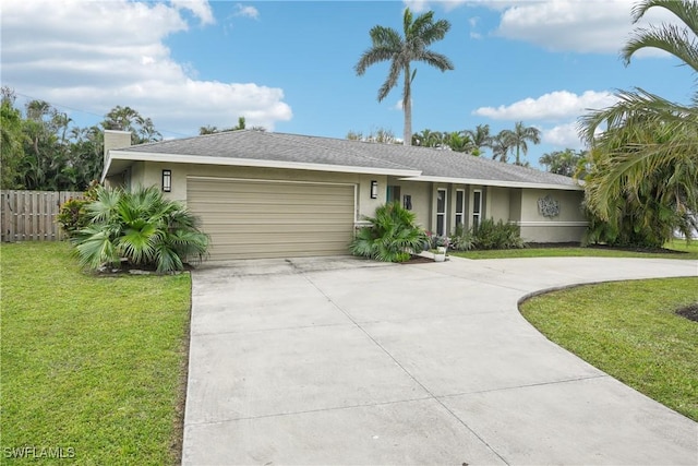 ranch-style home with an attached garage, fence, driveway, stucco siding, and a front lawn