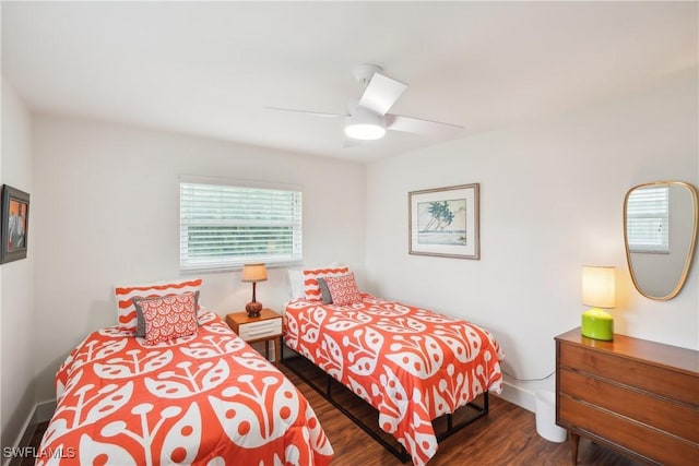 bedroom with a ceiling fan and wood finished floors