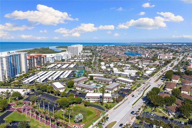 drone / aerial view featuring a view of city and a water view