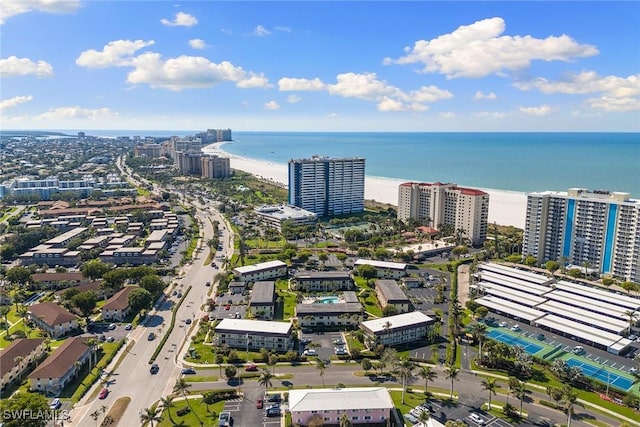 drone / aerial view featuring a water view and a view of city