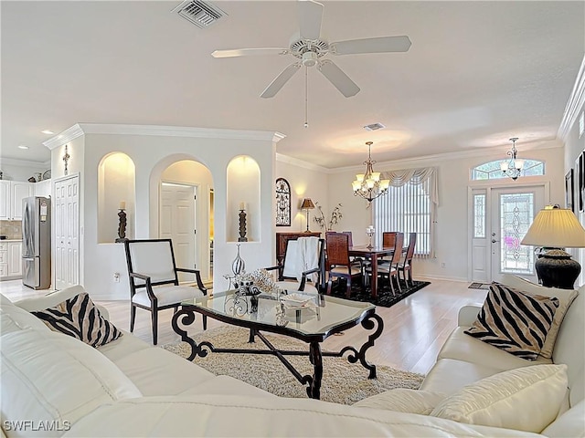 living room with visible vents, baseboards, light wood-style flooring, recessed lighting, and crown molding