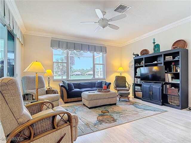 3519 Barnstable Ct, North Fort Myers, FL 33917 - living area with ornamental molding, wood finished floors, and a ceiling fan