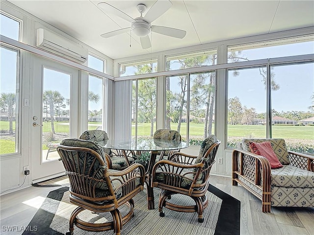 3519 Barnstable Ct, North Fort Myers, FL 33917 - sunroom / solarium featuring a wall unit AC, ceiling fan, wood finished floors, and outdoor dining space