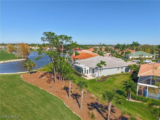 birds eye view of property featuring a water view