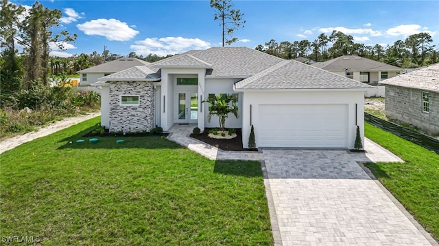 view of front of property with a garage, a shingled roof, decorative driveway, a front yard, and stucco siding