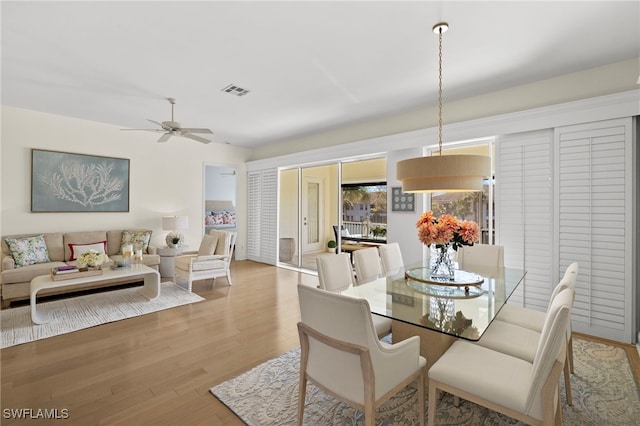 dining area featuring ceiling fan and wood finished floors