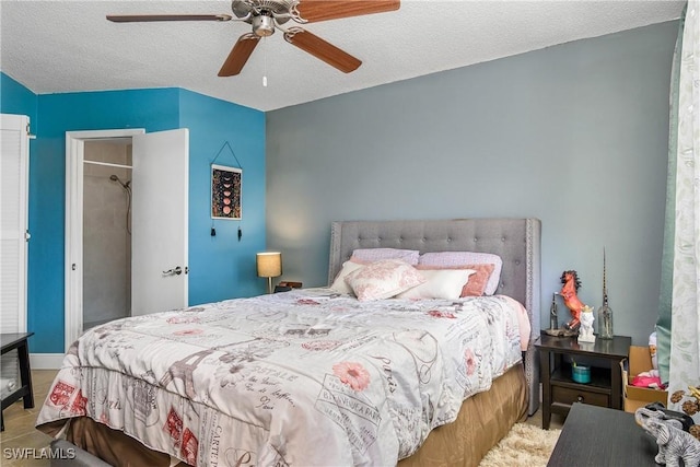 bedroom featuring ceiling fan and a textured ceiling