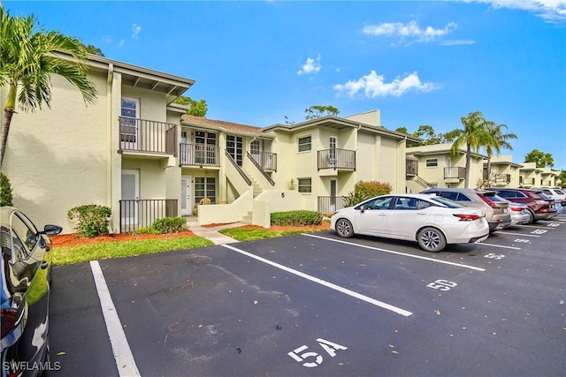 uncovered parking lot with a residential view