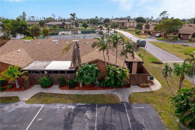 birds eye view of property with a residential view