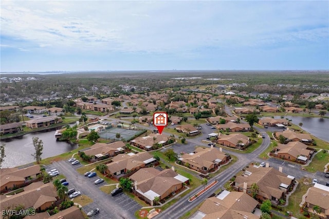 aerial view with a water view and a residential view