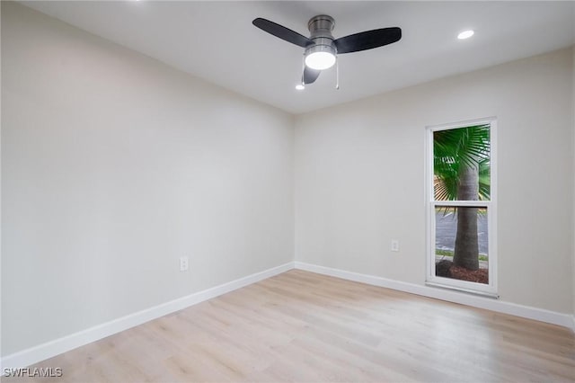 spare room with light wood-style floors, ceiling fan, baseboards, and recessed lighting