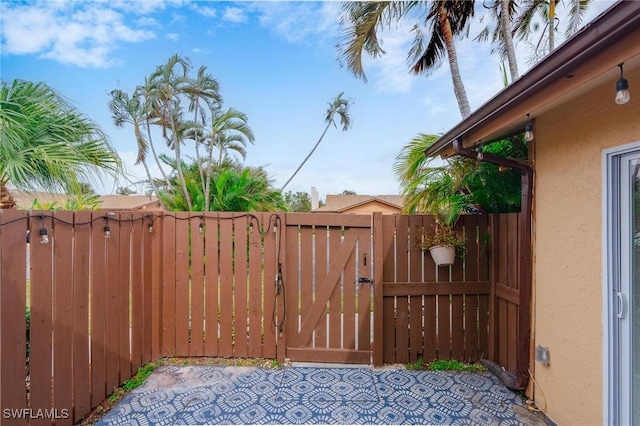 view of gate with fence