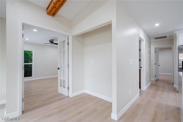 corridor featuring light wood finished floors, visible vents, baseboards, beamed ceiling, and recessed lighting