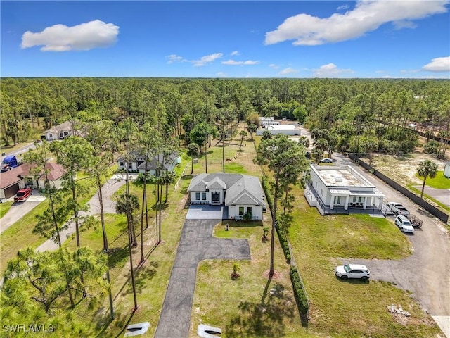 bird's eye view featuring a wooded view