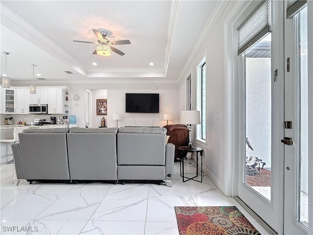 living area with marble finish floor, a ceiling fan, recessed lighting, crown molding, and a raised ceiling