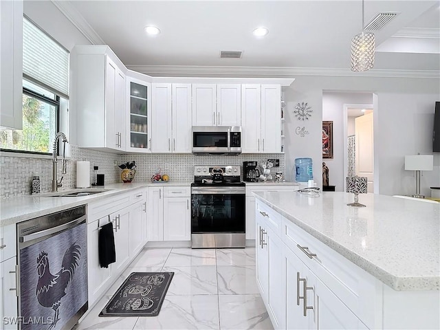 kitchen with visible vents, marble finish floor, a sink, stainless steel appliances, and crown molding