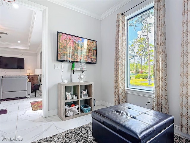 sitting room with marble finish floor, baseboards, and ornamental molding