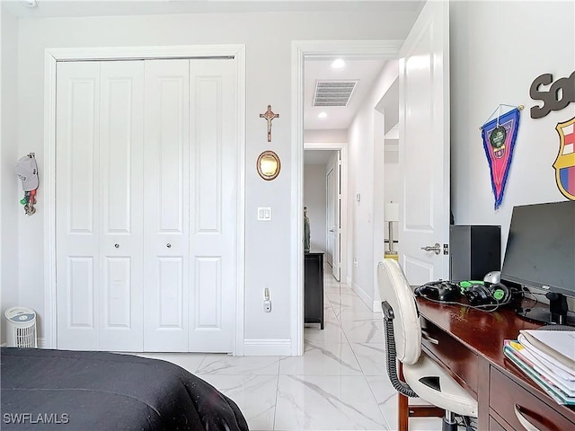 bedroom with visible vents, baseboards, marble finish floor, and a closet