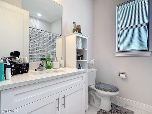 bathroom with toilet, marble finish floor, curtained shower, baseboards, and vanity