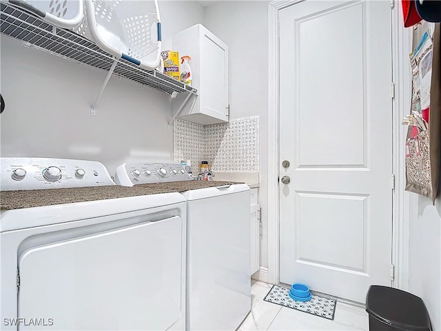 washroom with cabinet space and independent washer and dryer