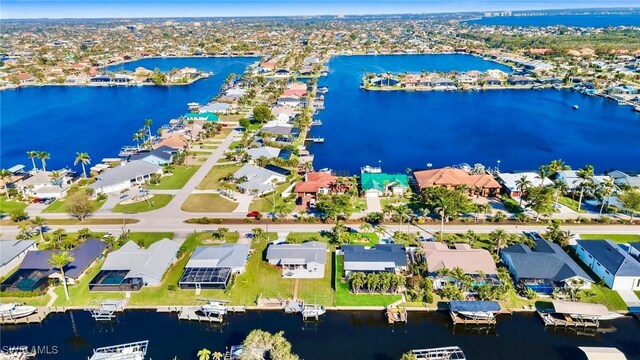 bird's eye view with a water view and a residential view