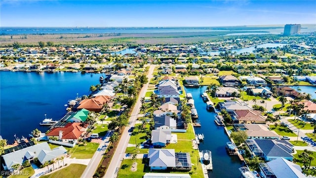 birds eye view of property featuring a water view and a residential view