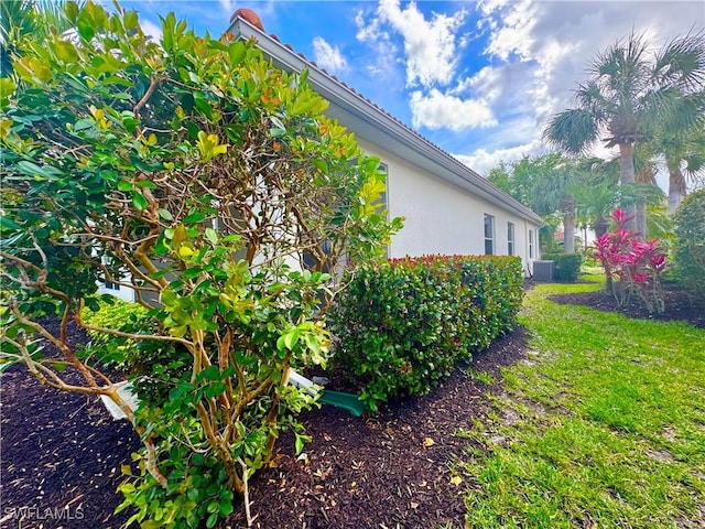 view of property exterior featuring central AC unit and stucco siding