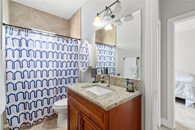 full bath with curtained shower, vanity, and toilet