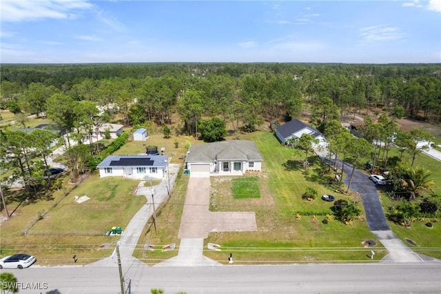 bird's eye view featuring a view of trees