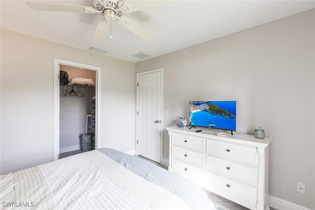 bedroom with baseboards, visible vents, and a ceiling fan