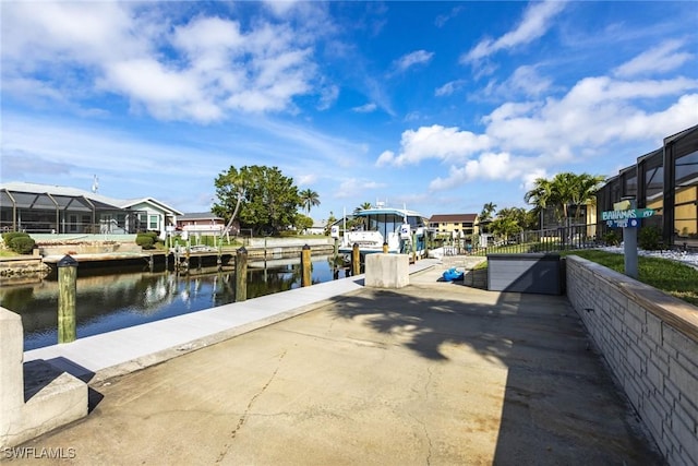 dock area with a residential view and a water view