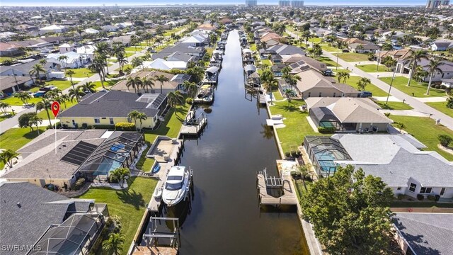 aerial view with a water view and a residential view