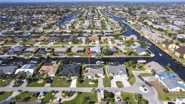 bird's eye view with a residential view and a water view