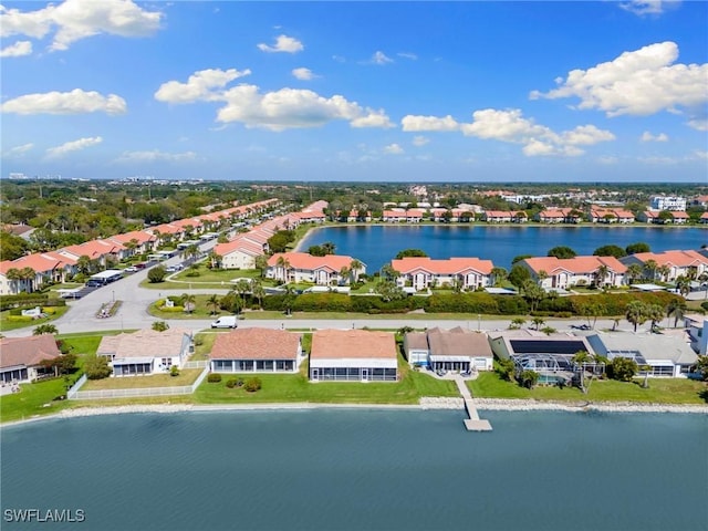 aerial view with a residential view and a water view