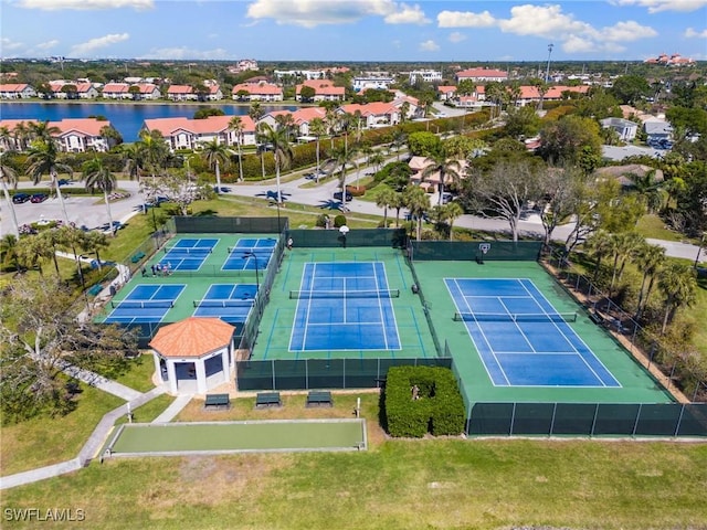 birds eye view of property featuring a residential view and a water view