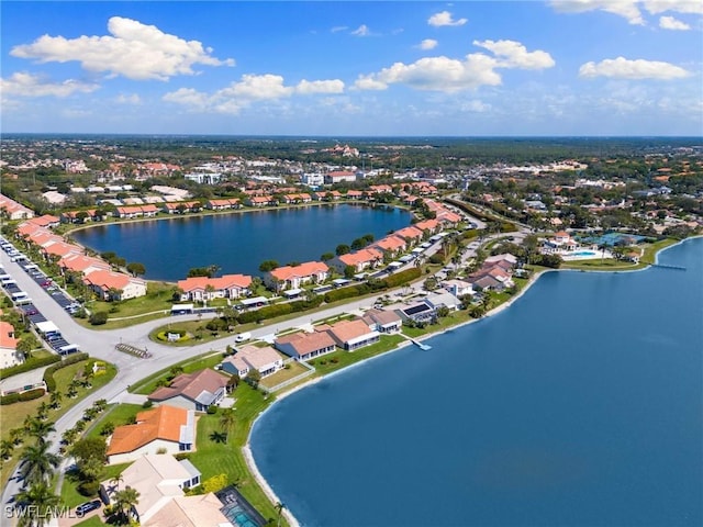 birds eye view of property with a residential view and a water view