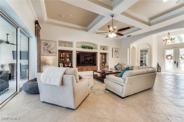 living room featuring arched walkways, french doors, crown molding, coffered ceiling, and beamed ceiling