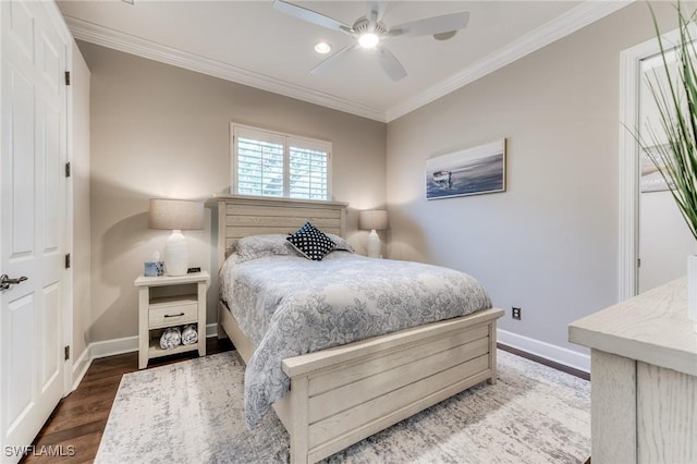 bedroom featuring ceiling fan, baseboards, crown molding, and wood finished floors