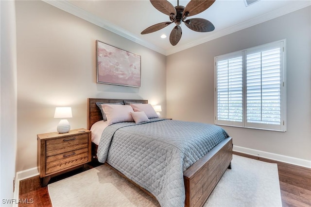 bedroom featuring ornamental molding, recessed lighting, baseboards, and wood finished floors