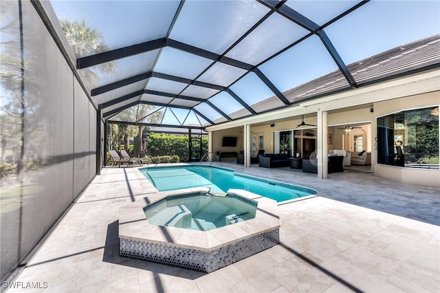 view of pool with glass enclosure, ceiling fan, a patio area, a pool with connected hot tub, and outdoor lounge area